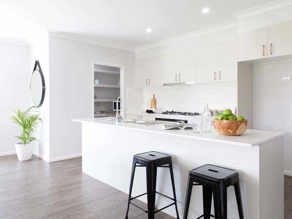 A large island bench with stone benchtops