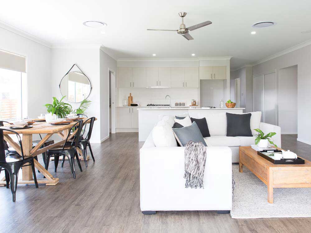 Stacker doors lead in from a large alfresco into the open pl